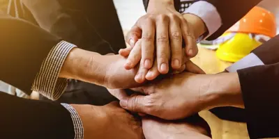 Hands stacked together
