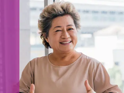 woman giving thumbs up with both hands