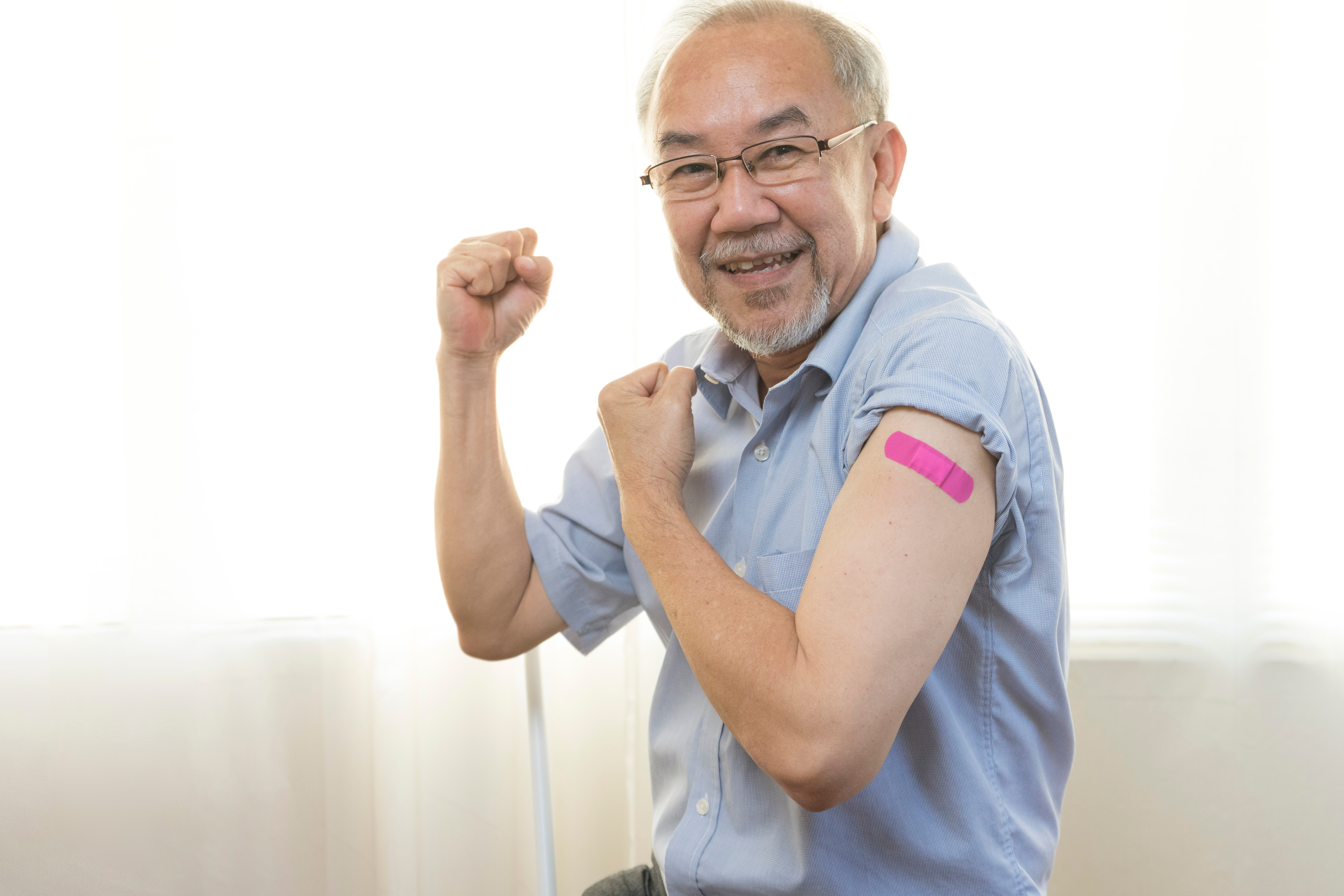 Man with band aid on arm