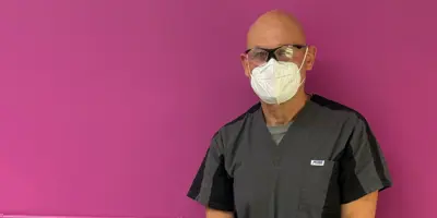 Foot Care nurse Al standing in footcare room at John Street