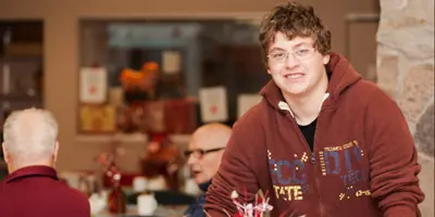 Student volunteering in the cafeteria