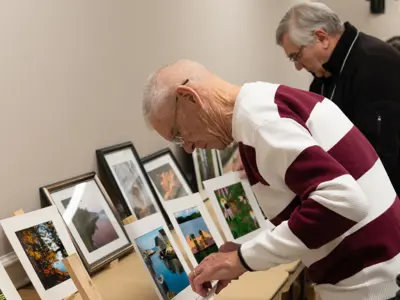 Image of man organizing photos