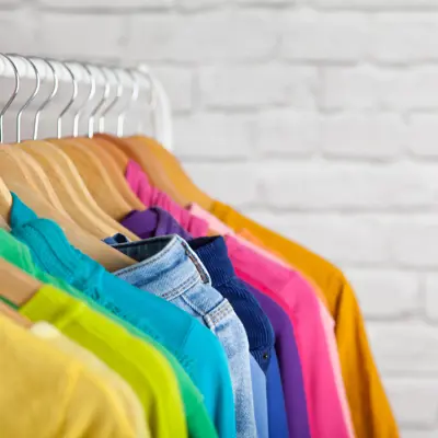 Rainbow clothing on a rack